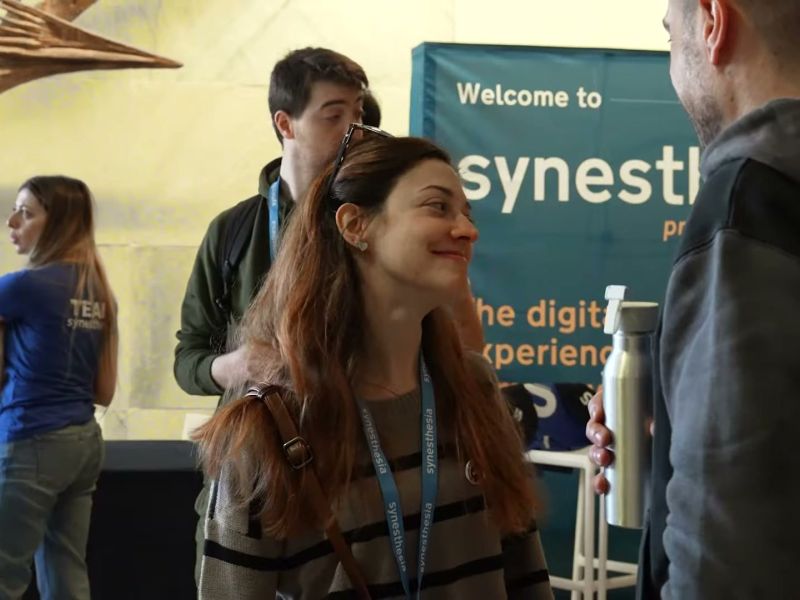 Attendees at the welcome desk of AI Heroes