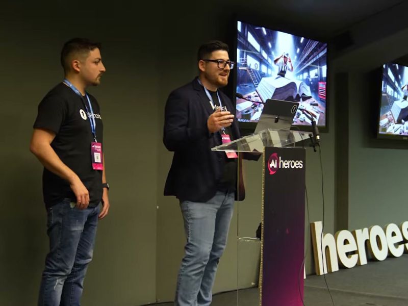 Two speakers on stage at AI Heroes